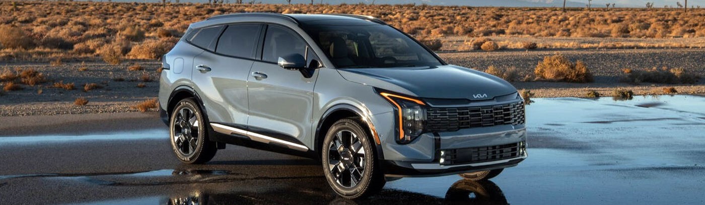 2026 Kia Sportage PHEV parked on rocky terrain.