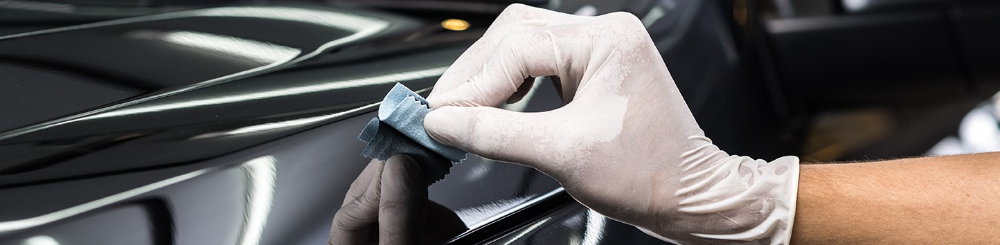 Unknown person wiping vehicle.