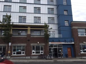 Exterior view of Rock Bay Landing Shelter in Victoria, BC, a community shelter that supports people experiencing homelessness.