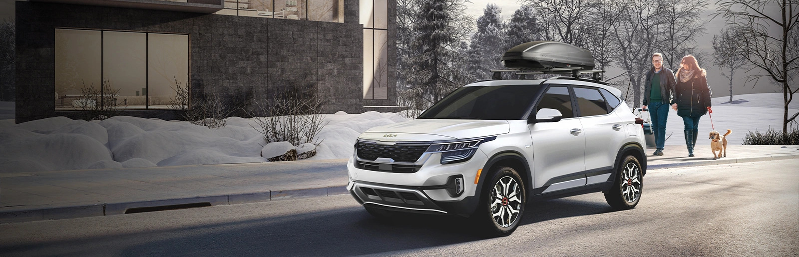 People walking near parked Kia in snowy area