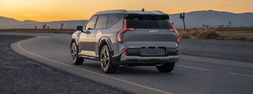 Kia EV9 driving down road