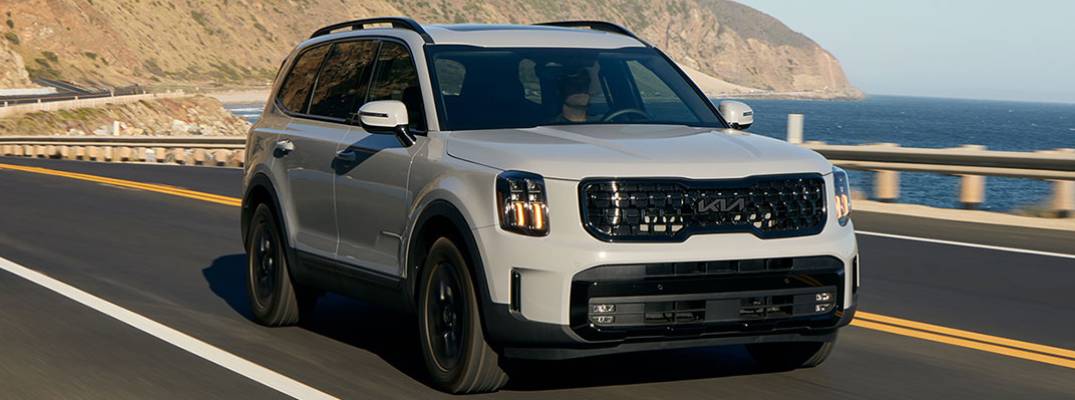Kia Telluride driving down street