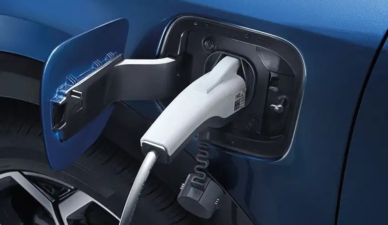 Charger plugged into EV