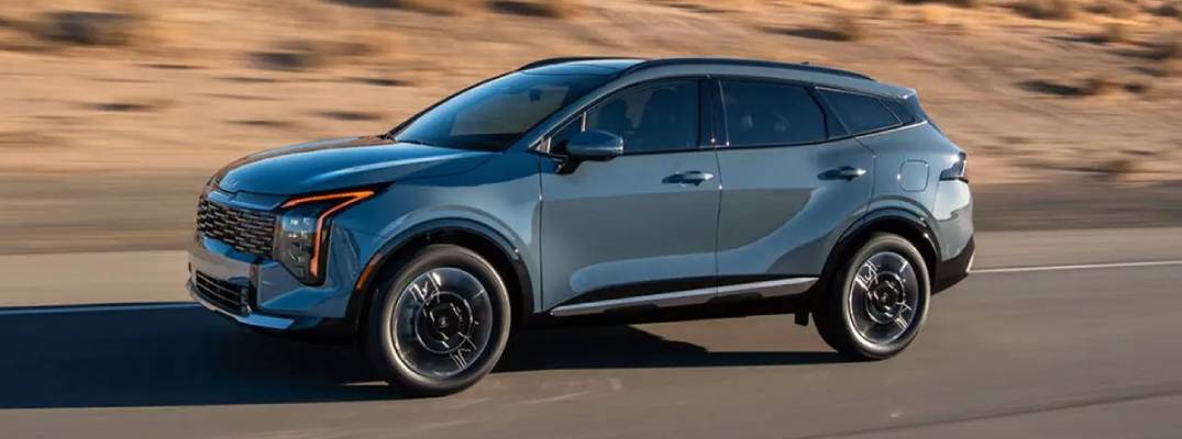 2026 Kia Sportage Hybrid driving down road